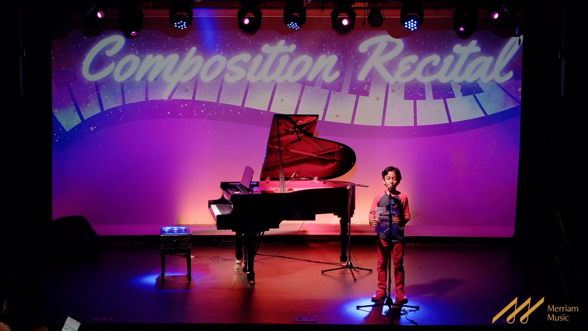 Student performing an original piece at the Merriam Composition Recital